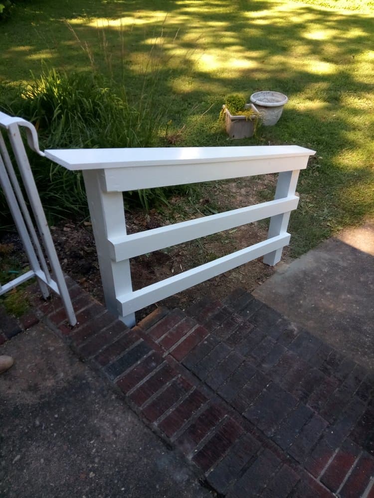Custom wooden hand railings built by Lamb Bros carpentry team